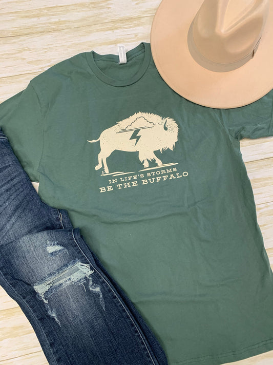 In Life's Storms Be The Buffalo green graphic tee